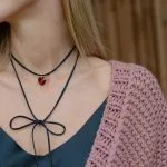 Set: black jewelry cord with red crystal and stud earrings