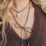 Dark brown jewelry cord with oval Mallorca shell pearl